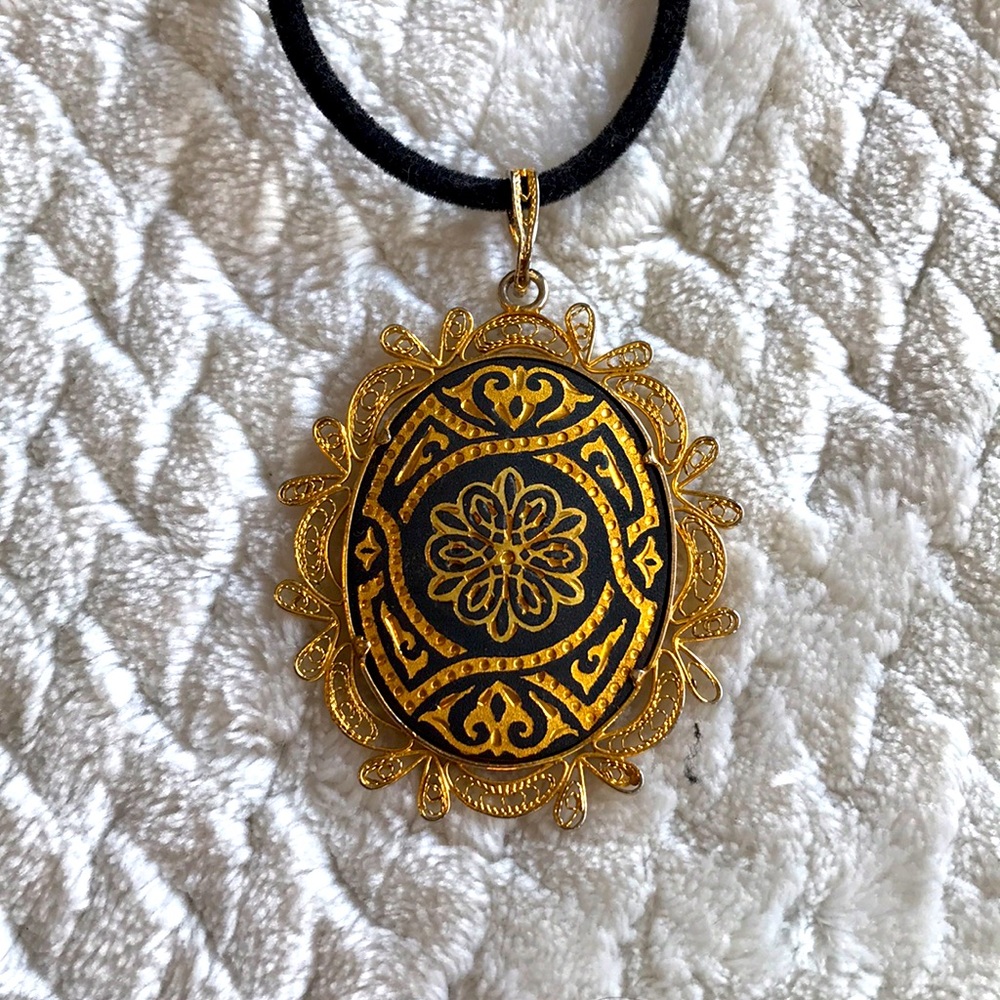 Gold and black medallian pendant